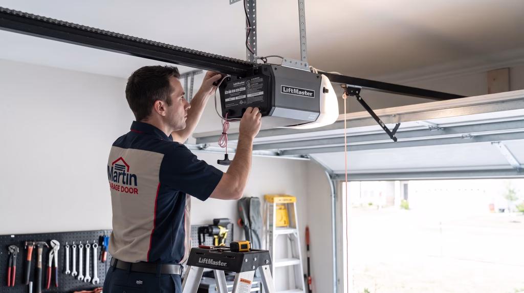 A technician standing on a ladder pressing buttons on a ceiling motor unit to Reset Your Garage Door Opener.