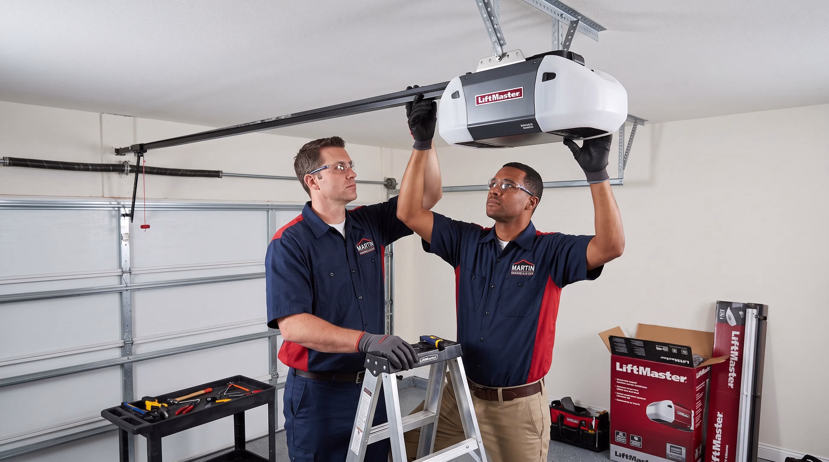 Two technicians working together to lift and secure a ceiling-mounted unit during a Professional Garage Door Opener Replacement.